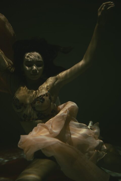 woman submerged underwater